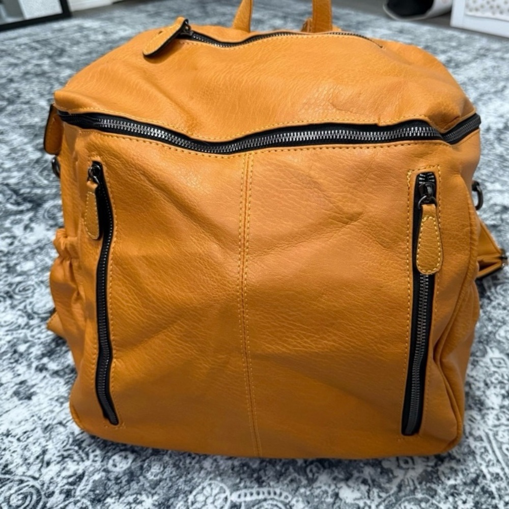 Stylish Orange Backpack with Zipper Details